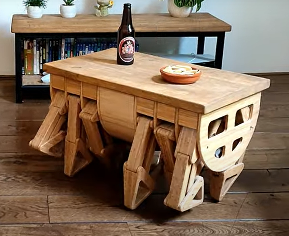 A carpenter from the Netherlands made a funny table with 12 legs that can move around the room to serve you food or drinks. Photos and video