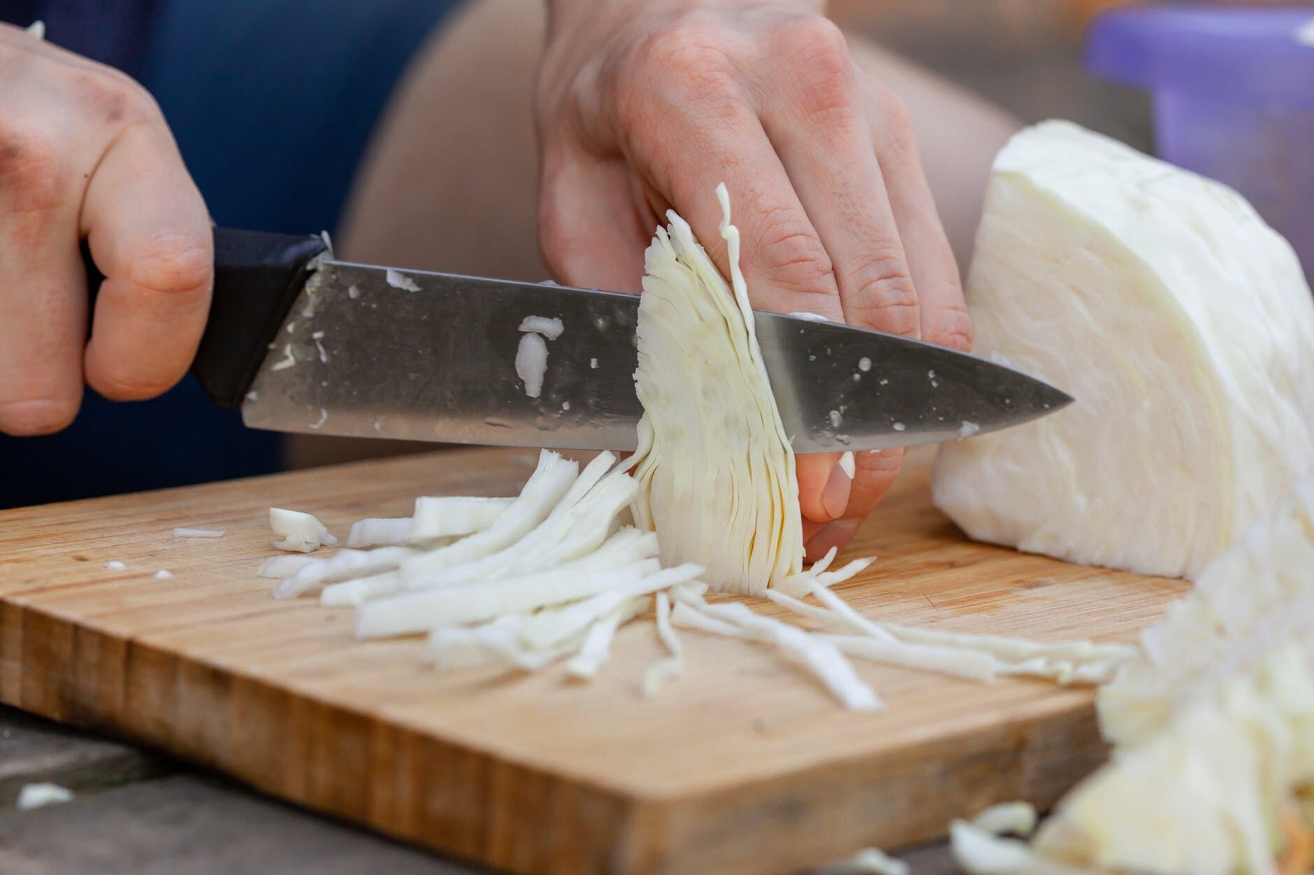 Chopping cabbage.