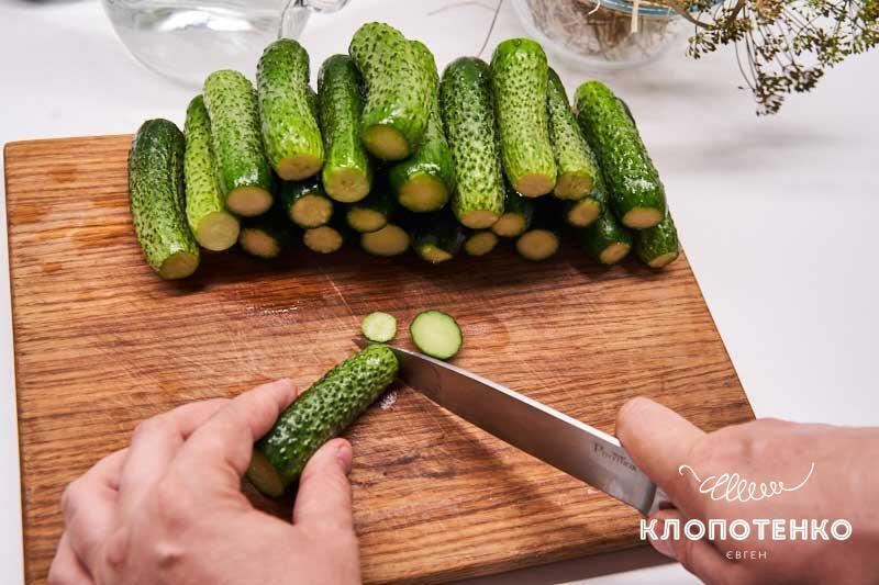 Chopping cucumbers.