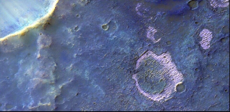 A ''smiley'' that may hide secrets about past Martian life spotted on the Red Planet. Photo