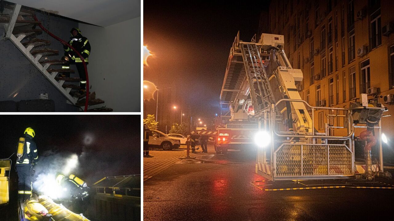 Rescuers extinguish fire on the roof of a high-rise building