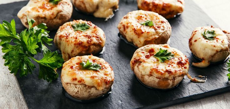 How to cook mushrooms in the oven: with cream and cheese