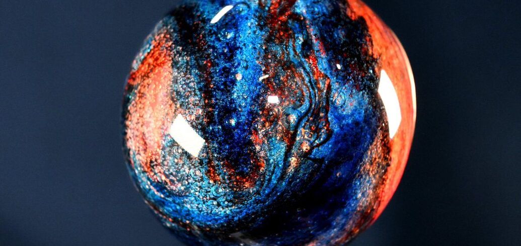 A NASA astronaut has created a 'Jupiter-like planet' on the ISS using water and food coloring. Photo