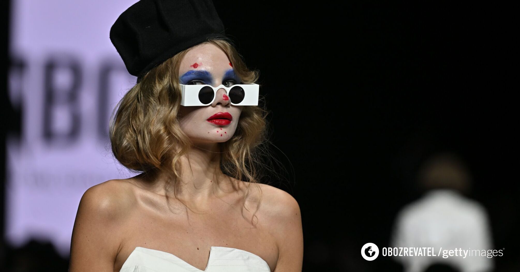 What 'high fashion' looks like in Russia: clown makeup, humble shirt and camouflage. Photo from Moscow Fashion Week