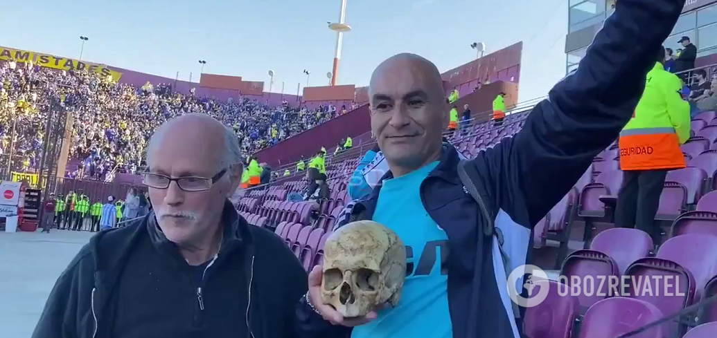 A fan dug up his grandfather's grave and brought his skull to the match. Video