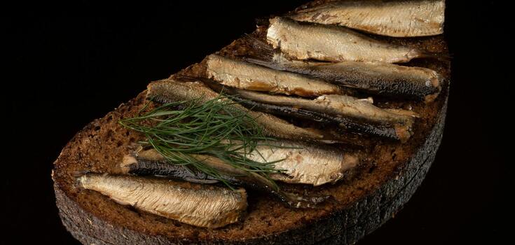Sprat sandwiches in a new way: a recipe for a simple appetizer for the New Year's table
