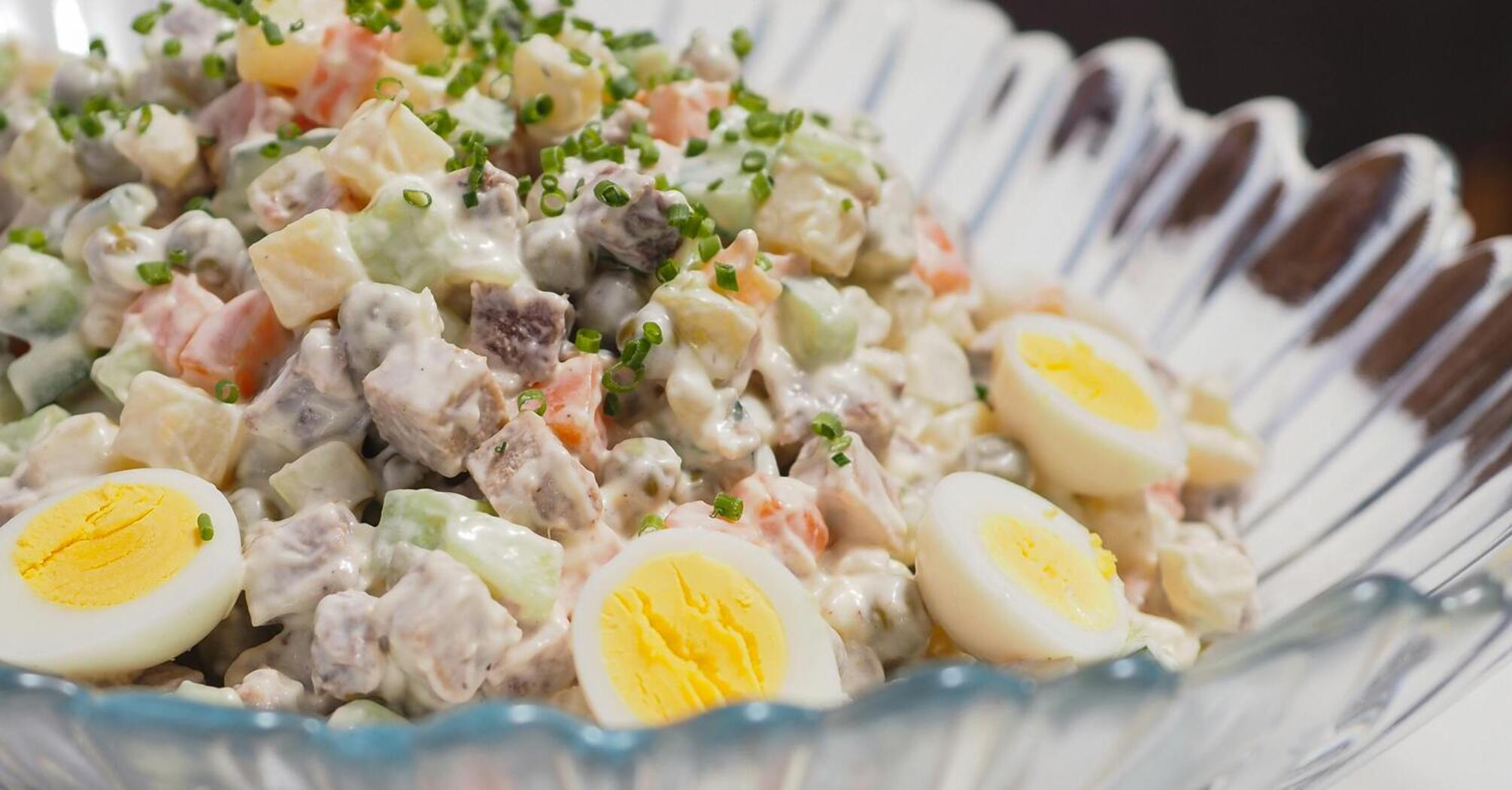 Without sausage and mayonnaise: healthy and tasty Olivier salad with apple and fish