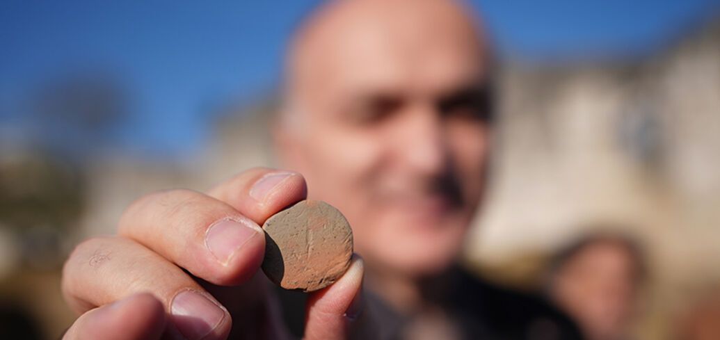 A Roman-era clay theater ticket found in Turkey. Photo