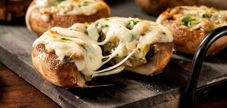 Stuffed mushrooms in the oven: recipe for juicy filling