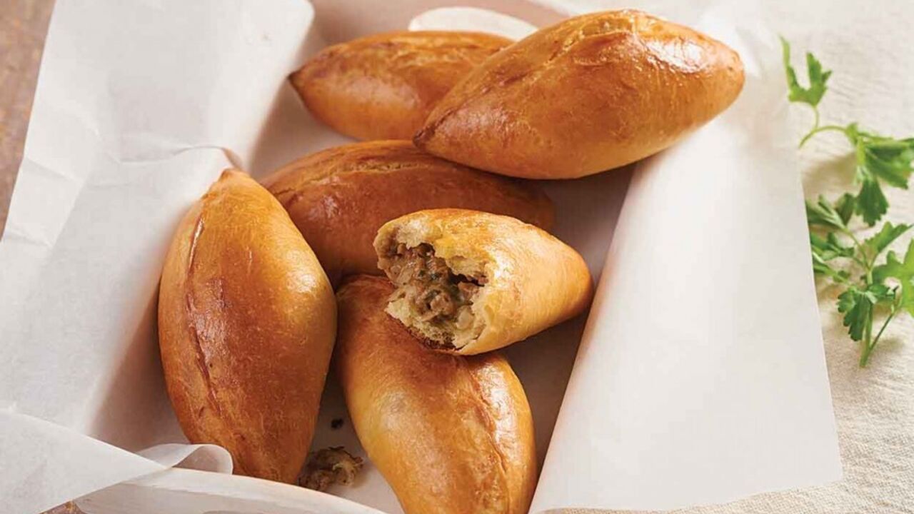 Puffy homemade cabbage pies: cooked with yeast dough