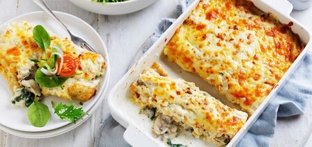 Julienne in a new way: baked pancakes with chicken, mushrooms and béchamel sauce