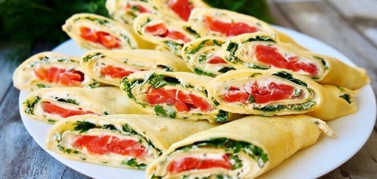 Hearty thin pancakes with cheese and red fish: be sure to cook them for lunch