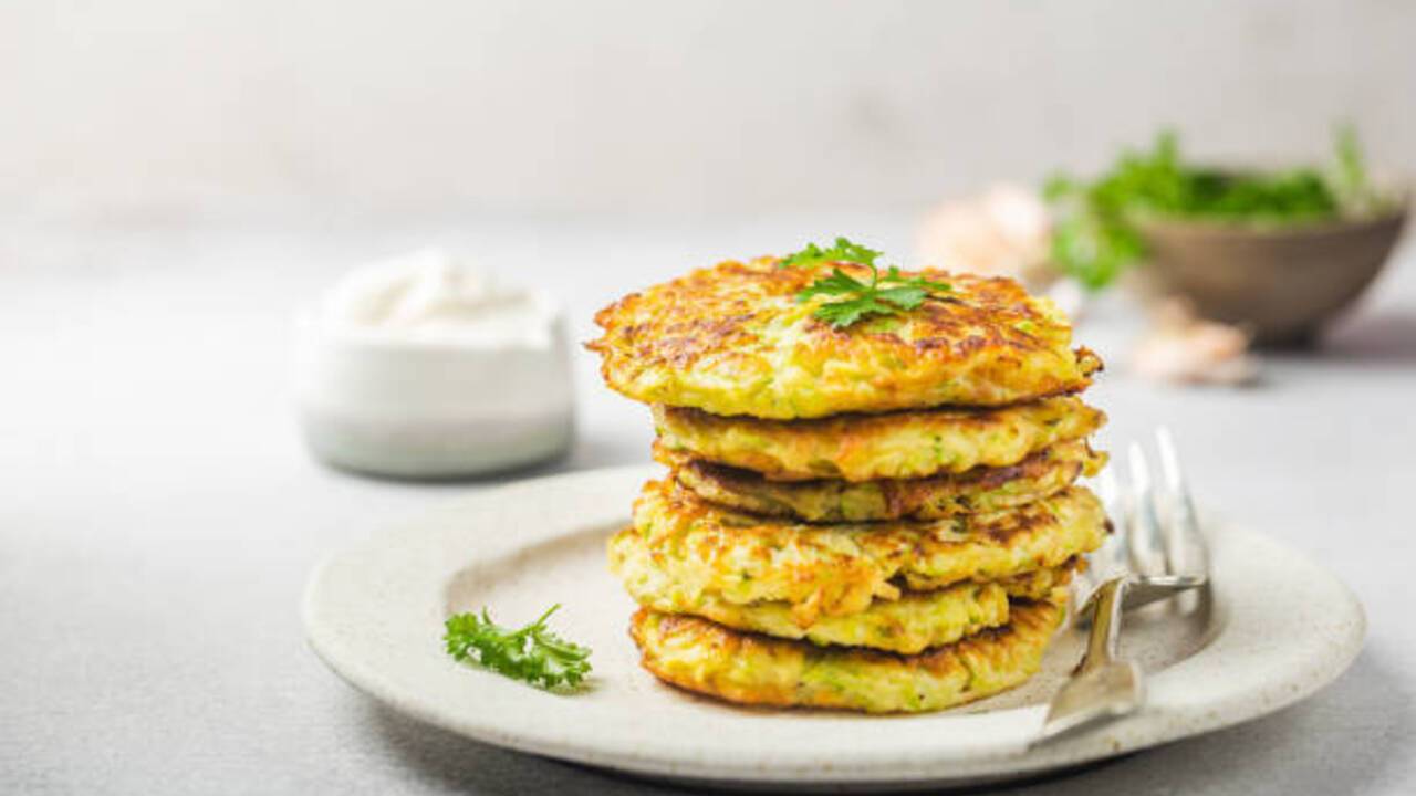 Zucchini pancakes with a secret: what to add to make the dish more delicious