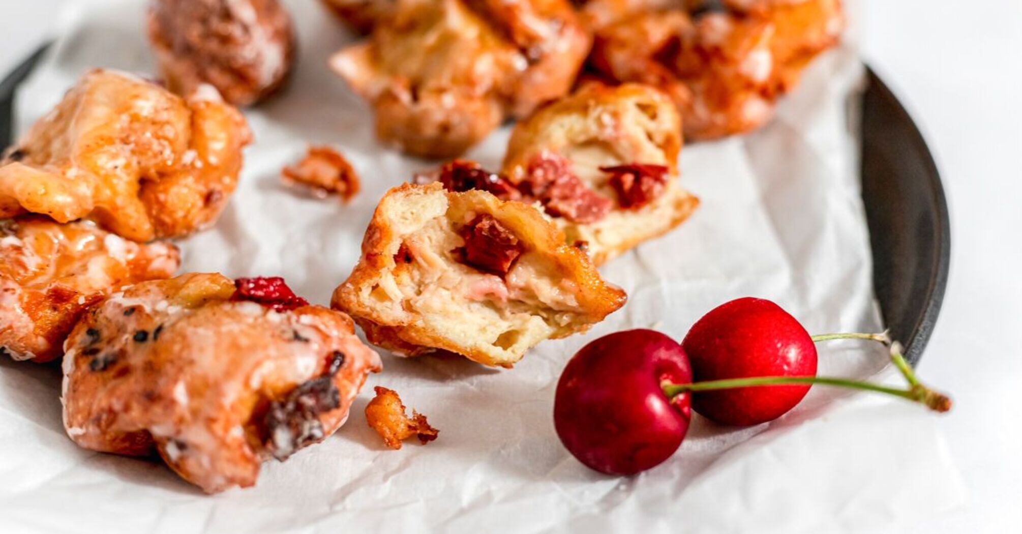 Fluffy fried pancakes with sweet cherries: do not burn and do not fall off