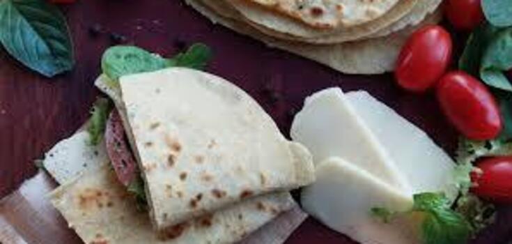Lazy pita bread envelopes with cheese and chicken fillet in minutes