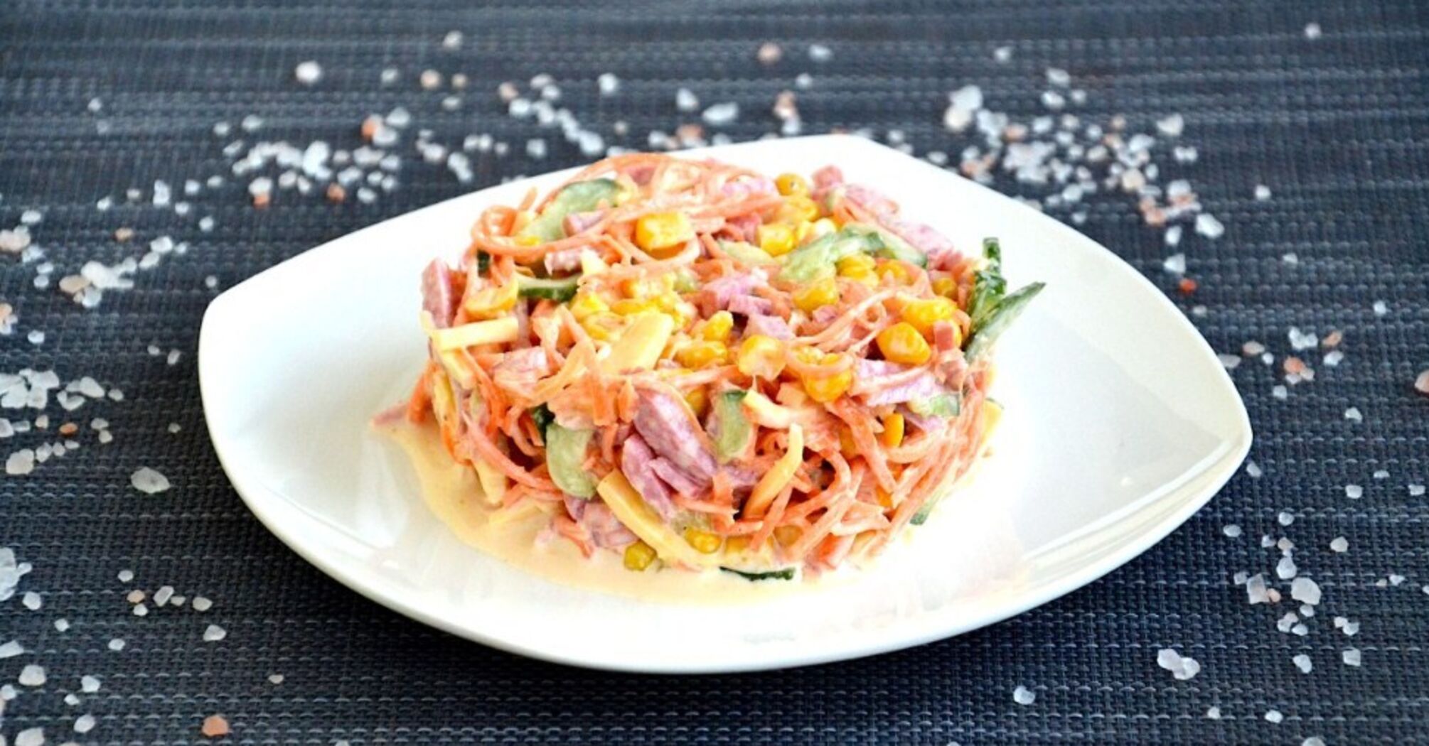 Bright salad of Korean-style carrots and sausage: dressed with mayonnaise