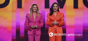 The hosts of Eurovision 2024 chose pantsuits in the colors of the stage. Photo