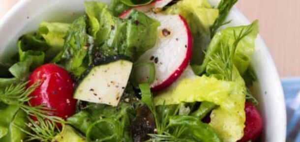 Light spring salad of fresh vegetables and greens: what to dress with