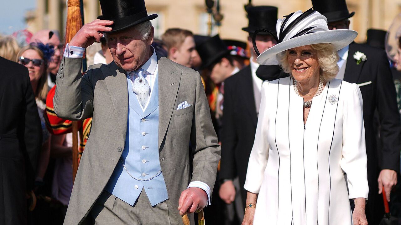 Leaning on an umbrella: King Charles III appeared in public with his wife, hiding his head in a tall cylinder. Photo