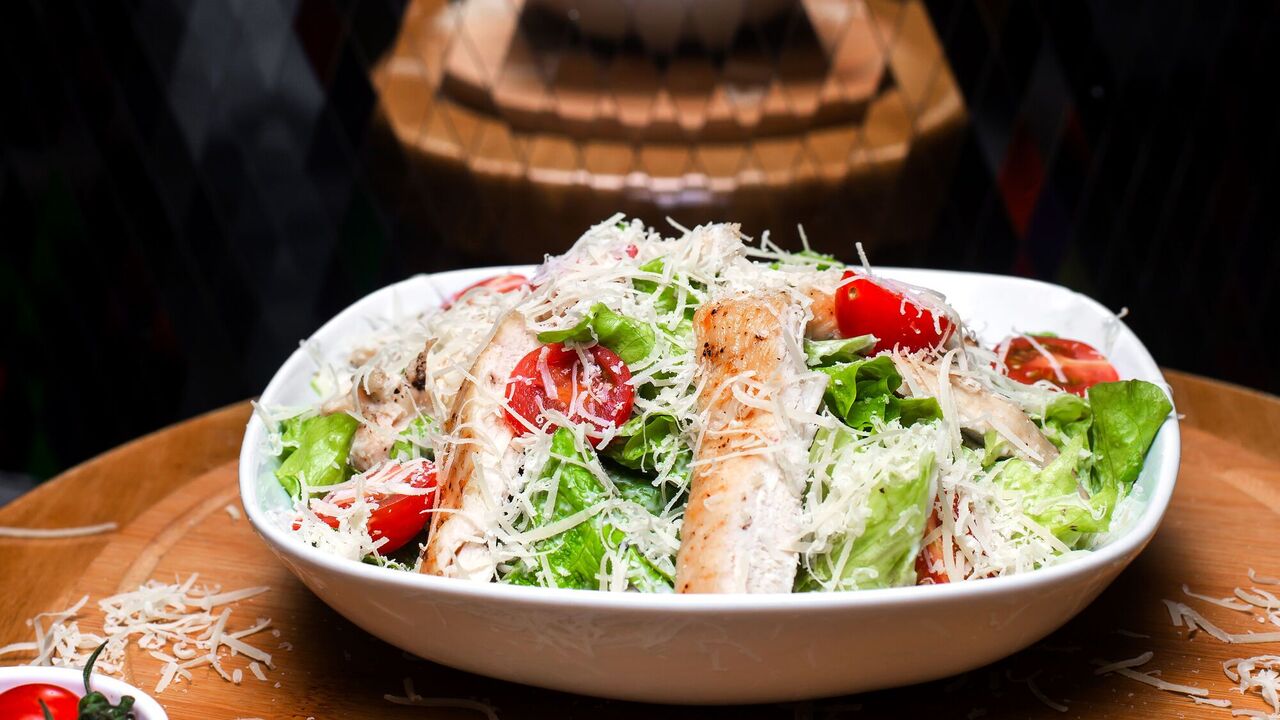 Healthy a la Caesar: a recipe for a light vegetable salad for a snack and a festive table