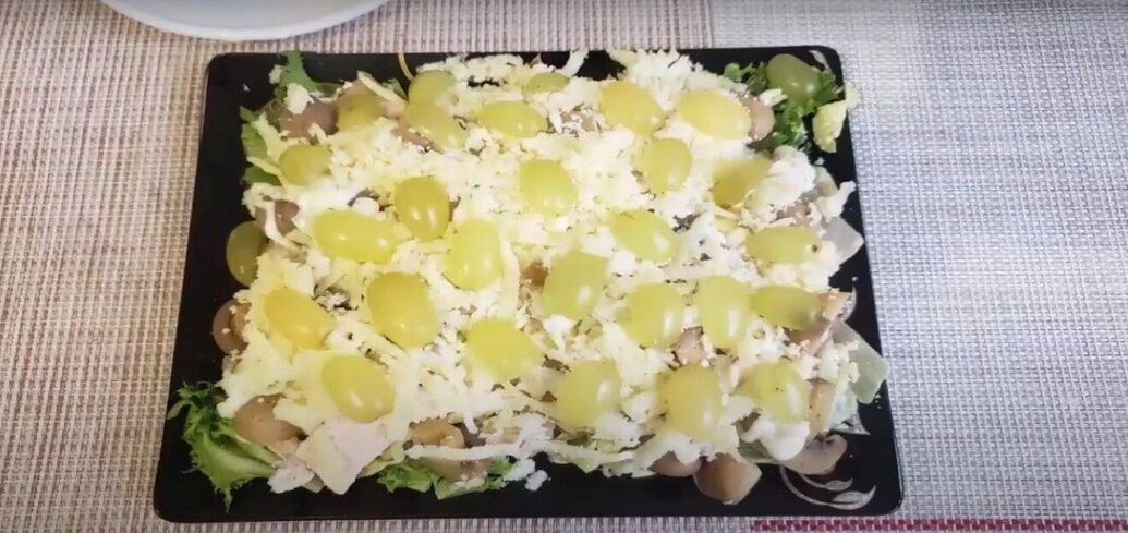 Exquisite Madame salad with fillet and grapes: dressed with mayonnaise