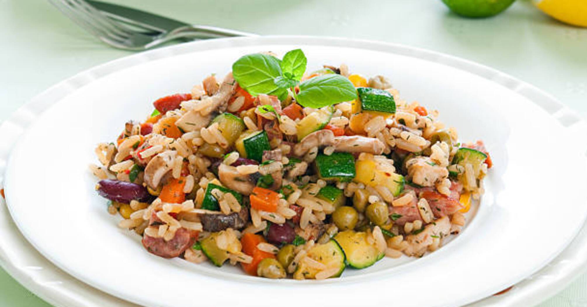 Rice with vegetables and meat: how to cook a delicious side dish in the oven