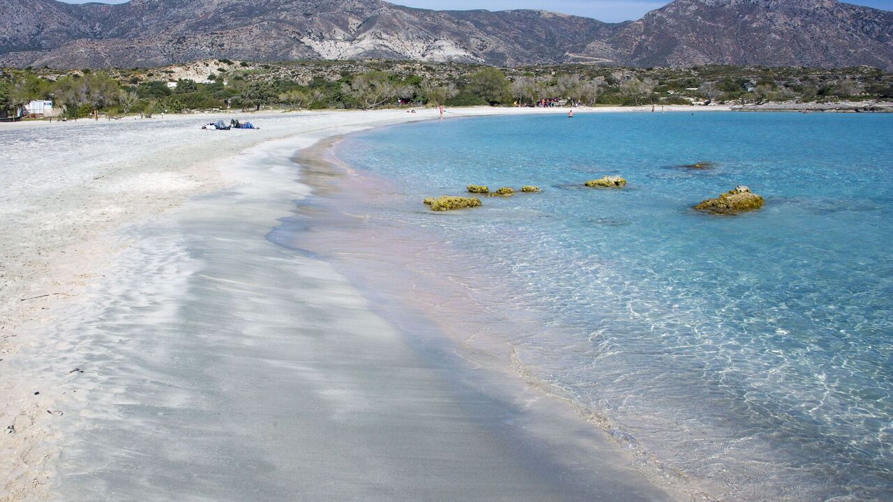 Pink sand and turquoise sea. A remote Greek beach was named one of the best in Europe
