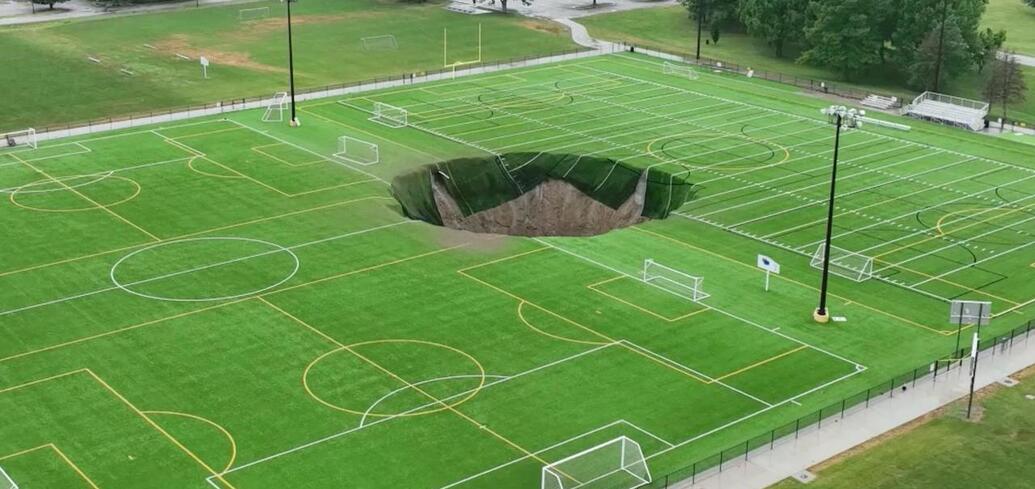 Sinkhole swallows part of football field in the US: the incident was caught on camera