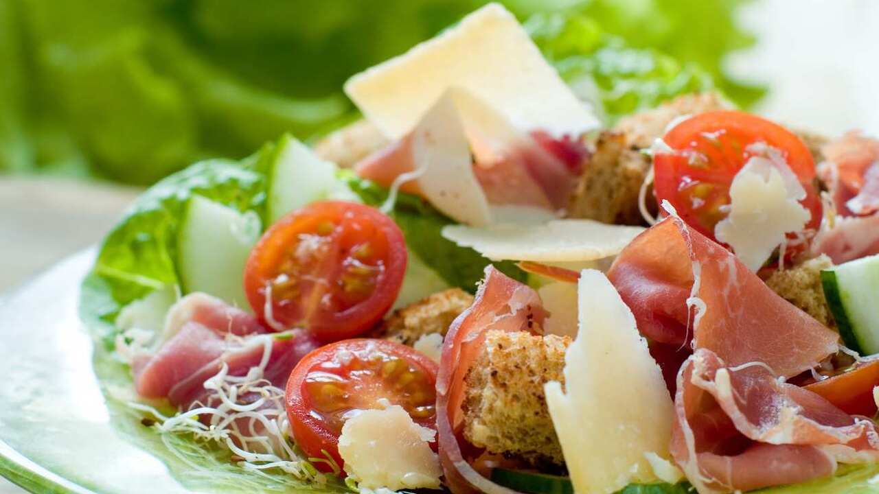 Light salad without mayonnaise with jamon: what to season with