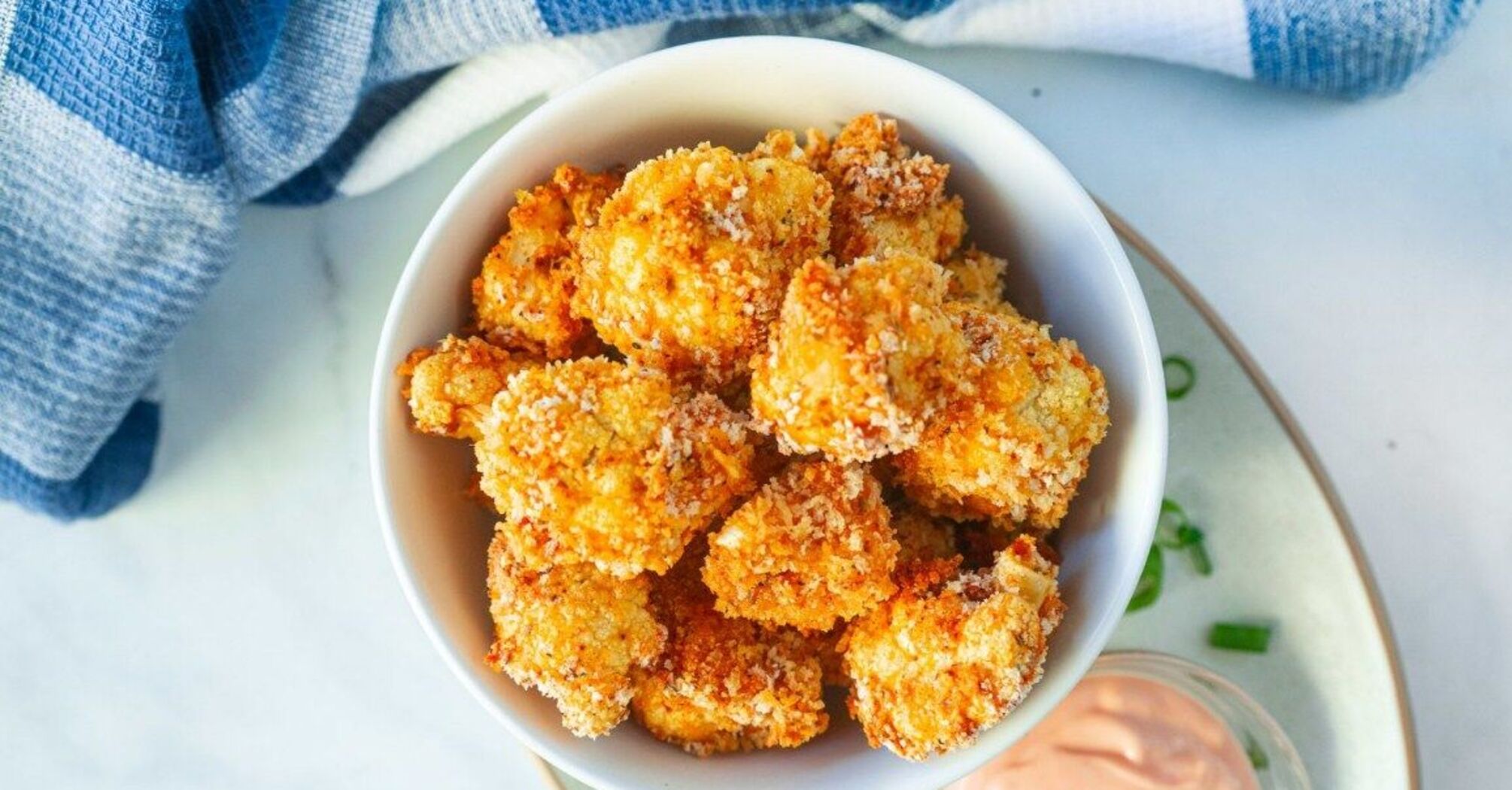 Battered with cheese: how to bake cauliflower in the oven in an unusual and tasty way