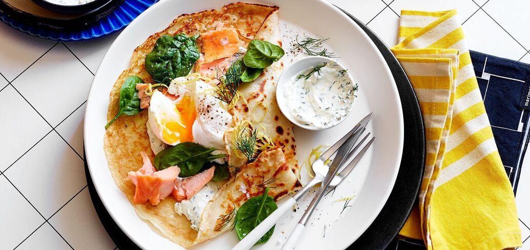 Pancakes with soft egg and smoked fish