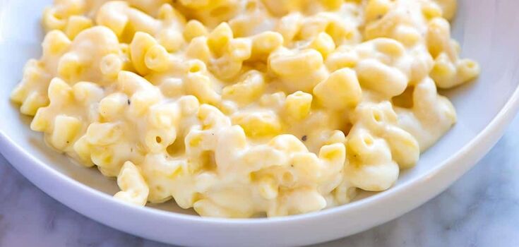 Pasta with cheese and cream in a frying pan
