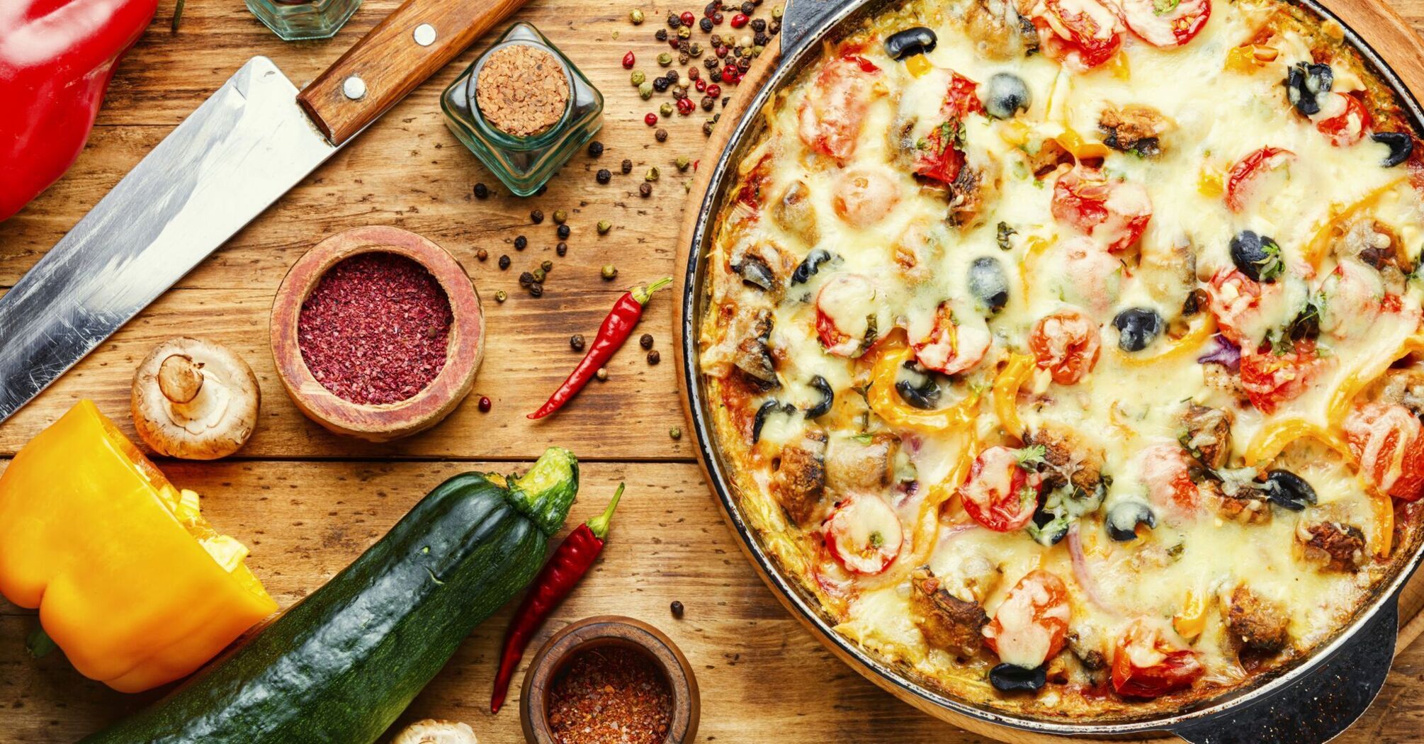 Pizza with vegetables in a pan