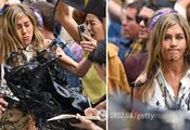 Jennifer Aniston gets splashed with oil during filming: the Friends star looks furious. Photo