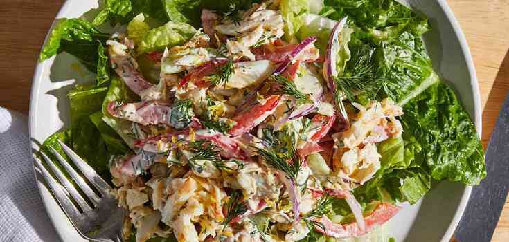 Summer crab salad: add lots of fresh vegetables and cheese