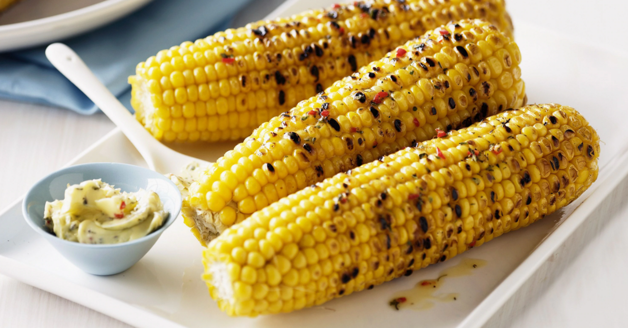 Baked young corn with butter and spices: a recipe for a snack dish