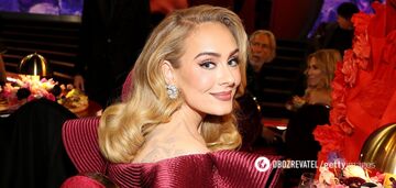 Adele gives a boost to fall mood by changing classic French for velvet nails. Photo