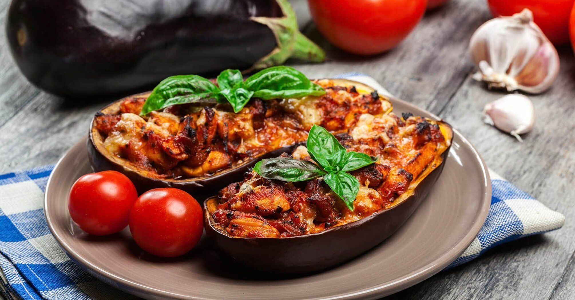 Tastier than meat: baked eggplant with cheese and tomato for dinner
