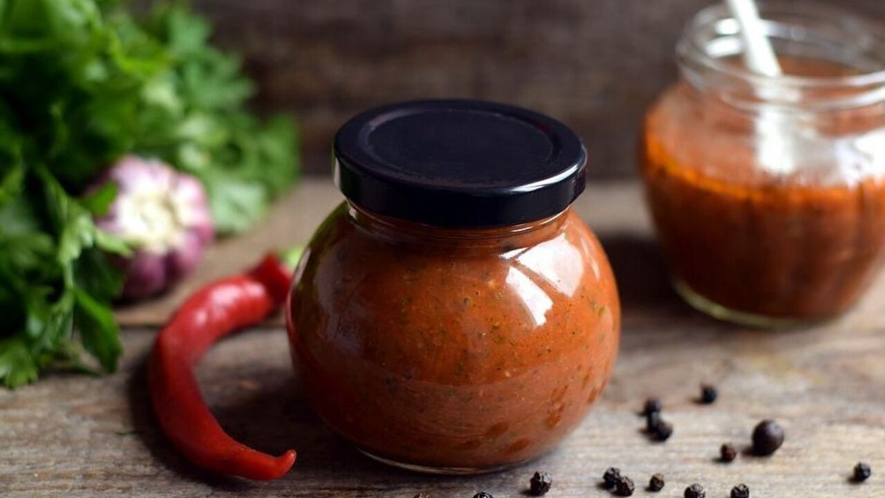 Zucchini adjika with tomato paste: recipe for a spicy appetizer for the winter