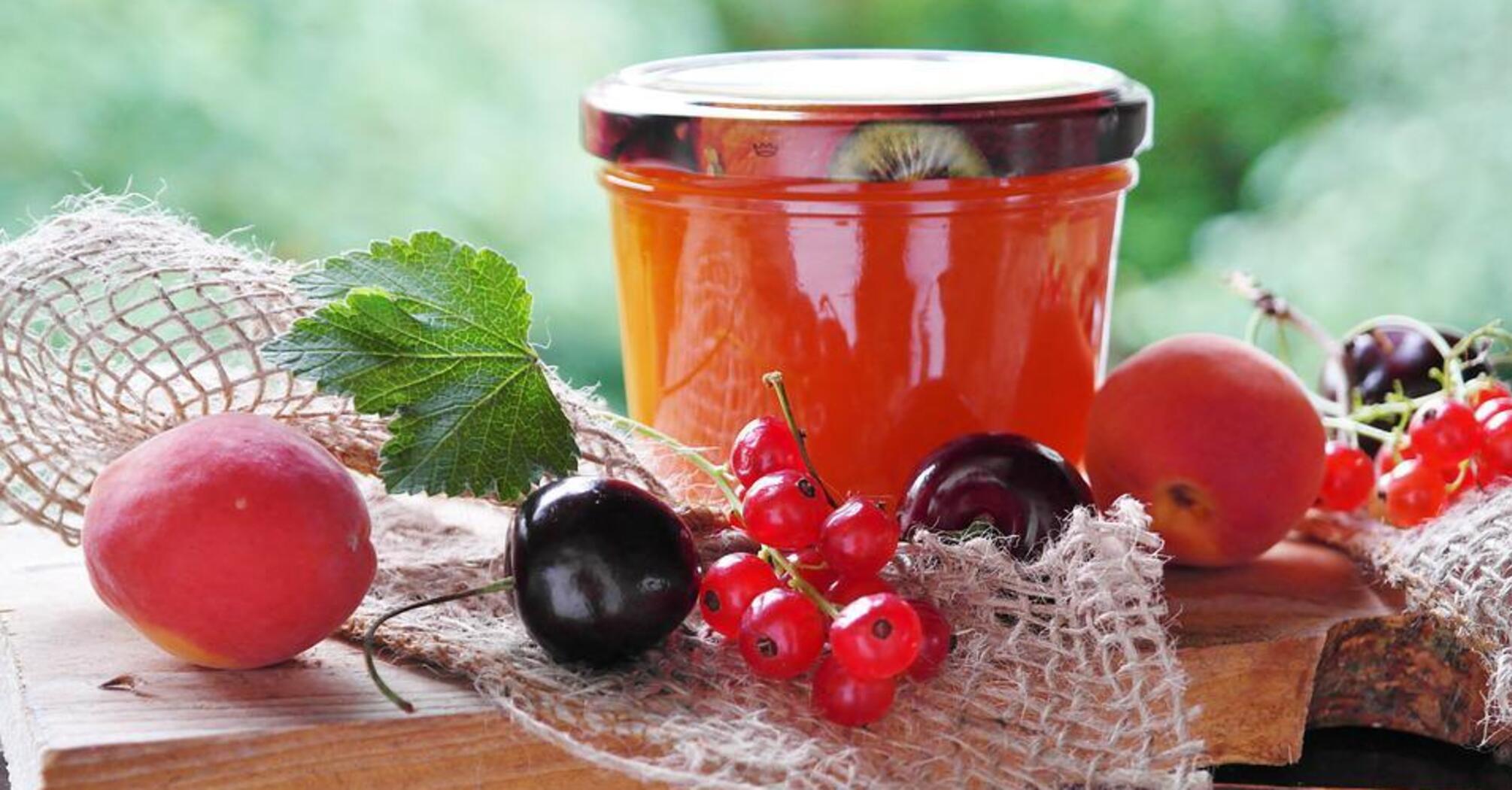 Thick berry jam mix: with raspberries, jostaberries and blueberries