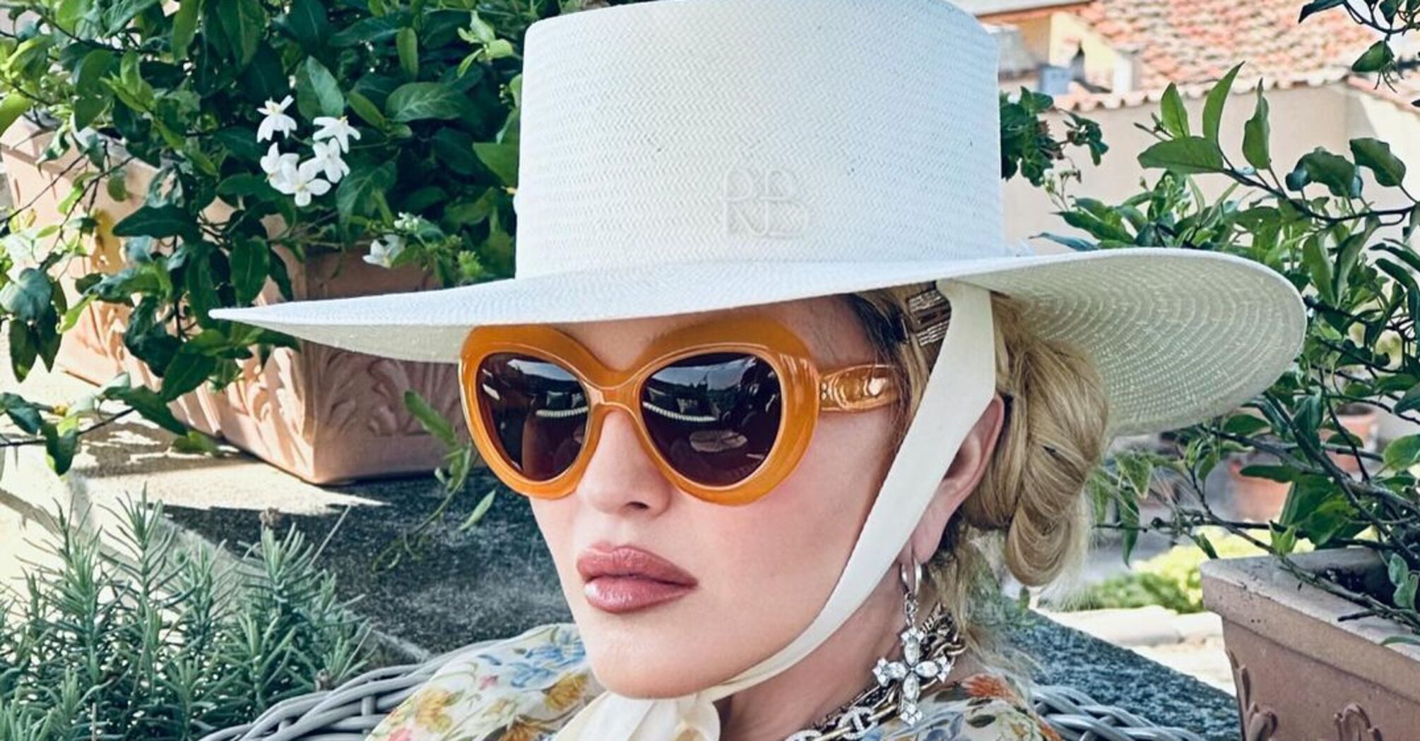 In a hat from a Ukrainian brand. Madonna showed new photos with her young boyfriend while on vacation in Rome