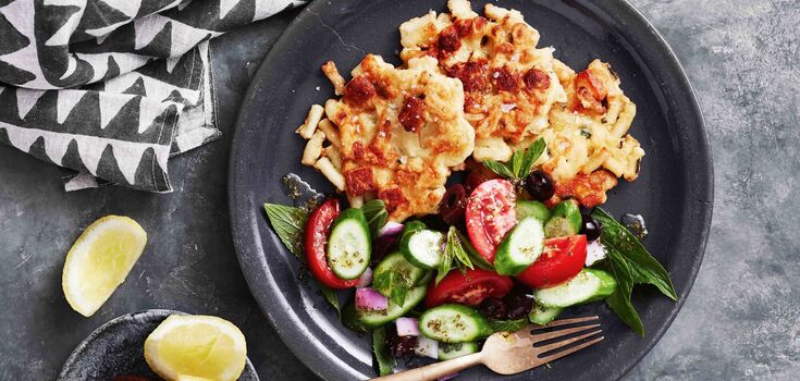 Tastes like pizza: lazy patties with meat and vegetables in a pan