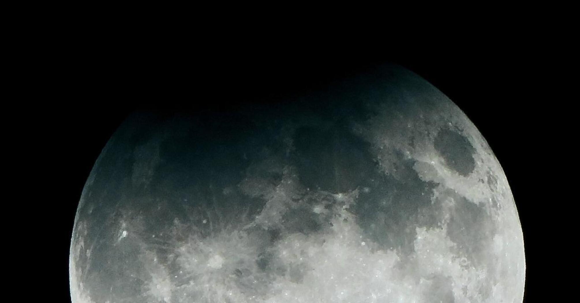 Harvest Supermoon covered by the Earth's shadow: a unique eclipse captured on camera. Photo