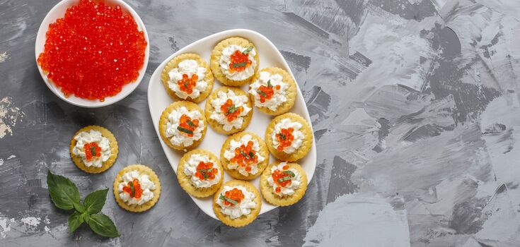 Waffle rolls with caviar: how to prepare an unusual festive appetizer