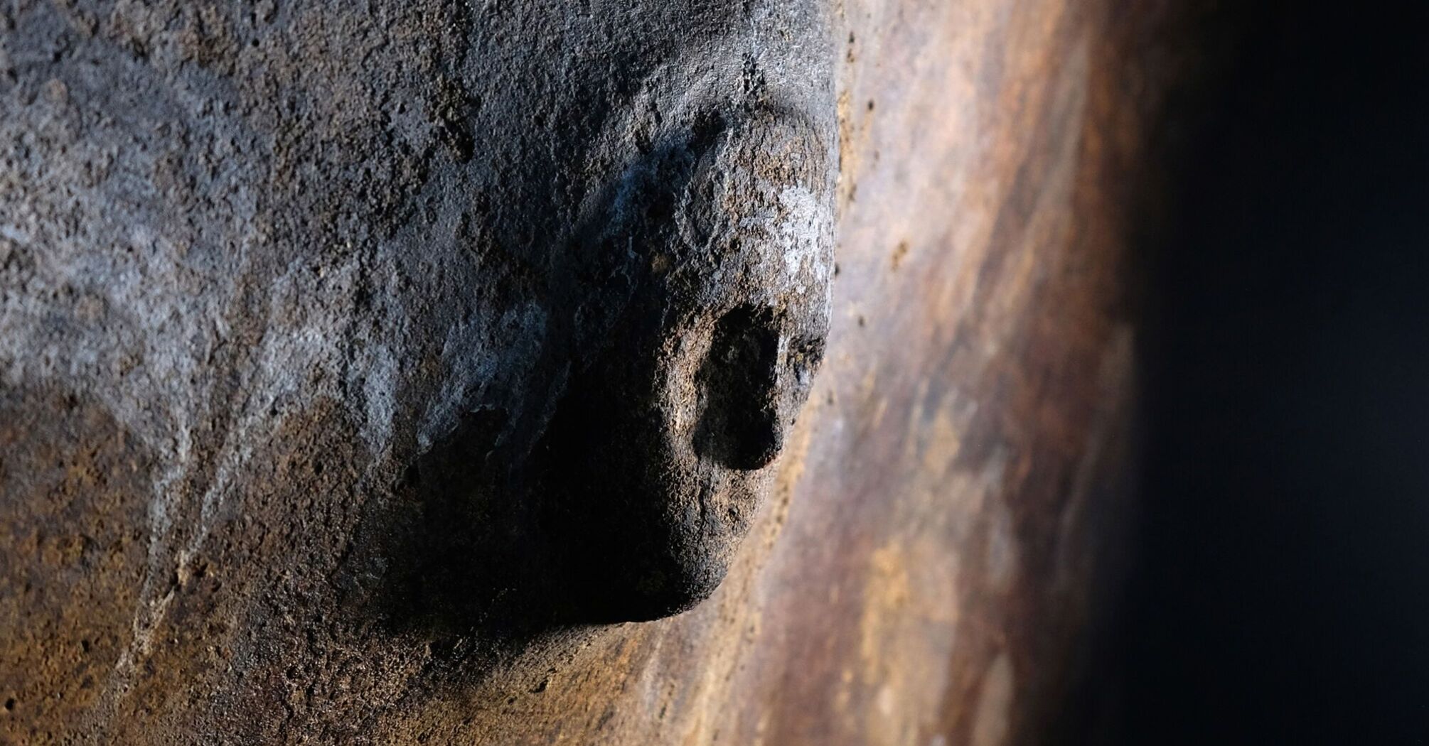 Archaeologists have discovered a mysterious human face on the wall of a cistern in Libya. Photo