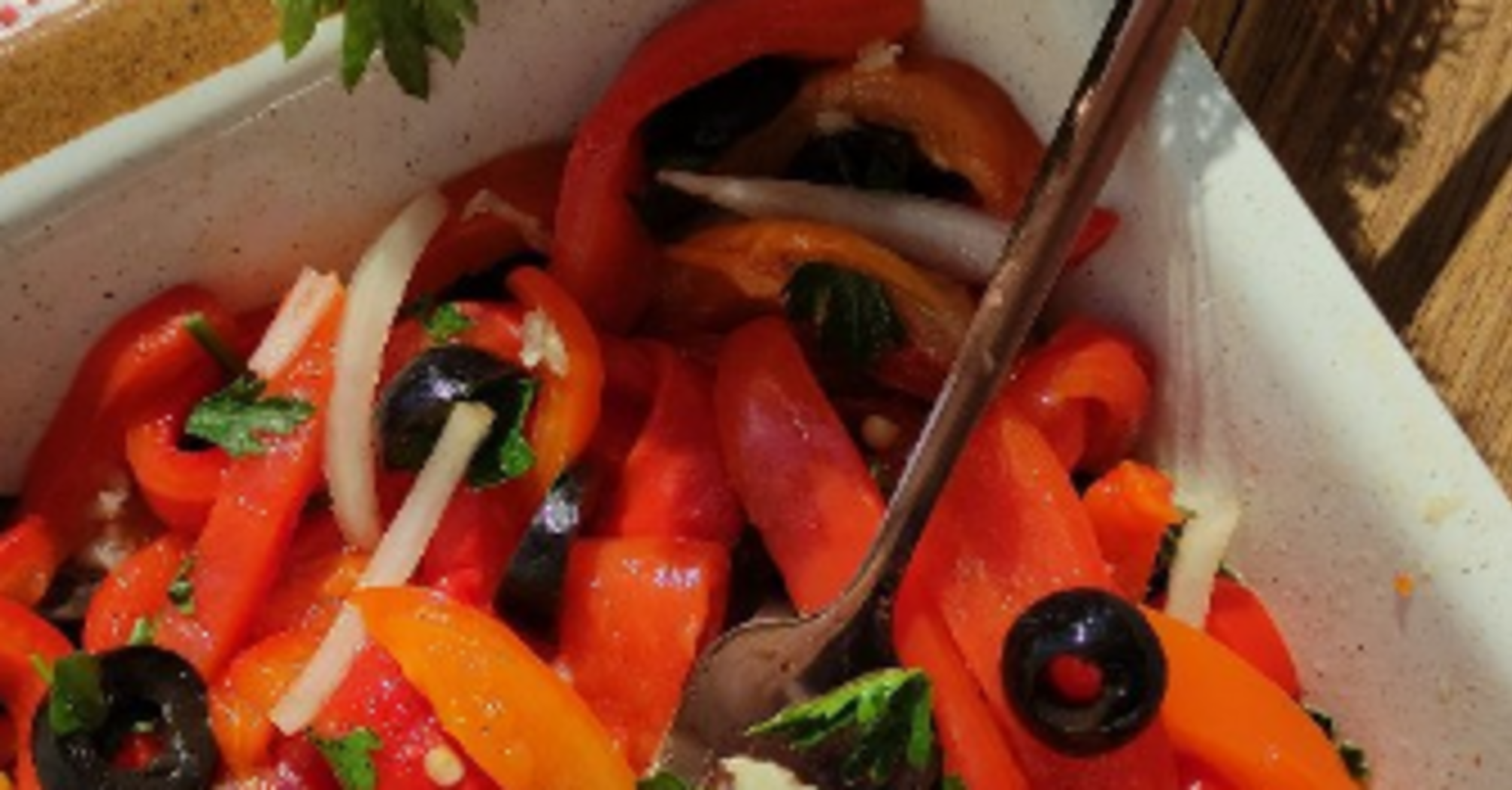 Salad with roasted peppers, olives, and garlic: perfect for a snack