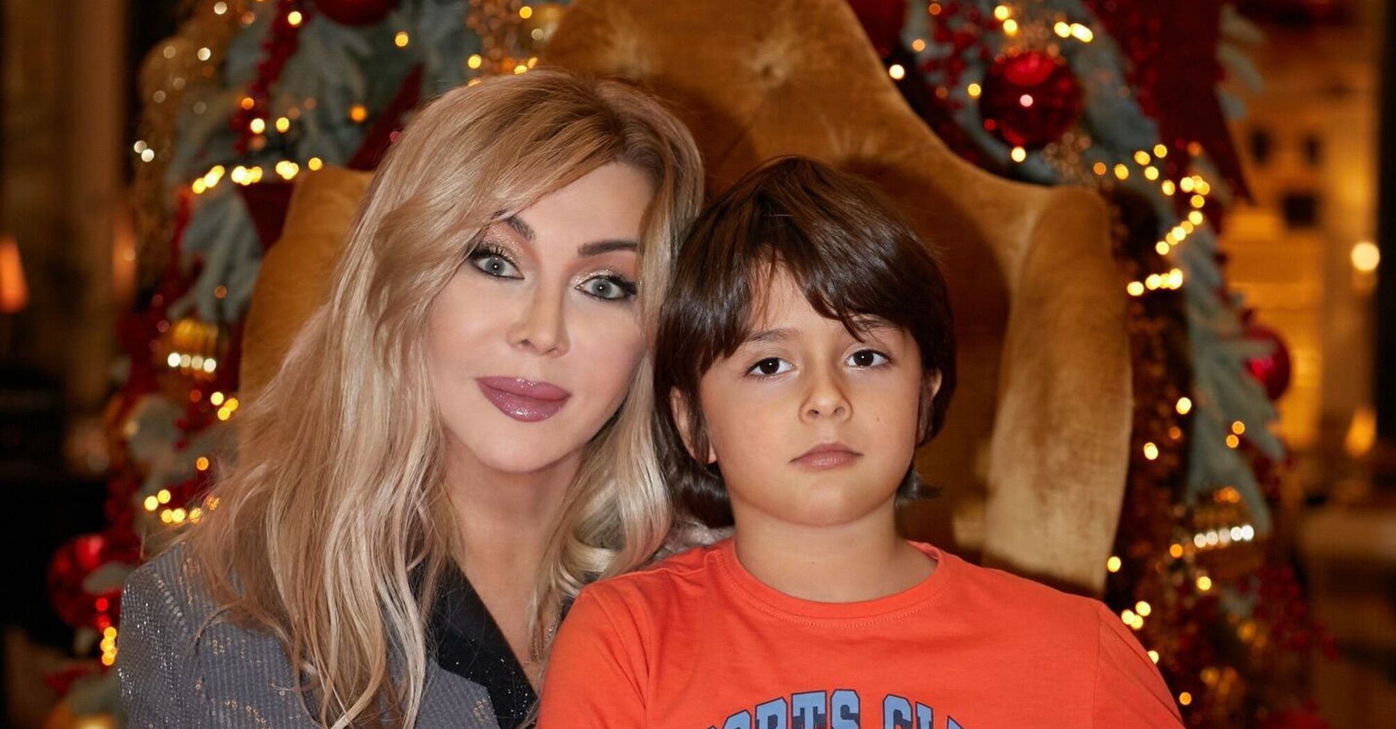 Iryna Bilyk shows how her youngest son Tabriz, who was born to a surrogate mother, has grown up. Photo